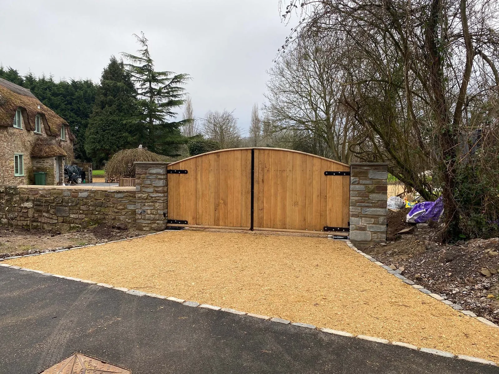 Large wooden gates to large cottage home