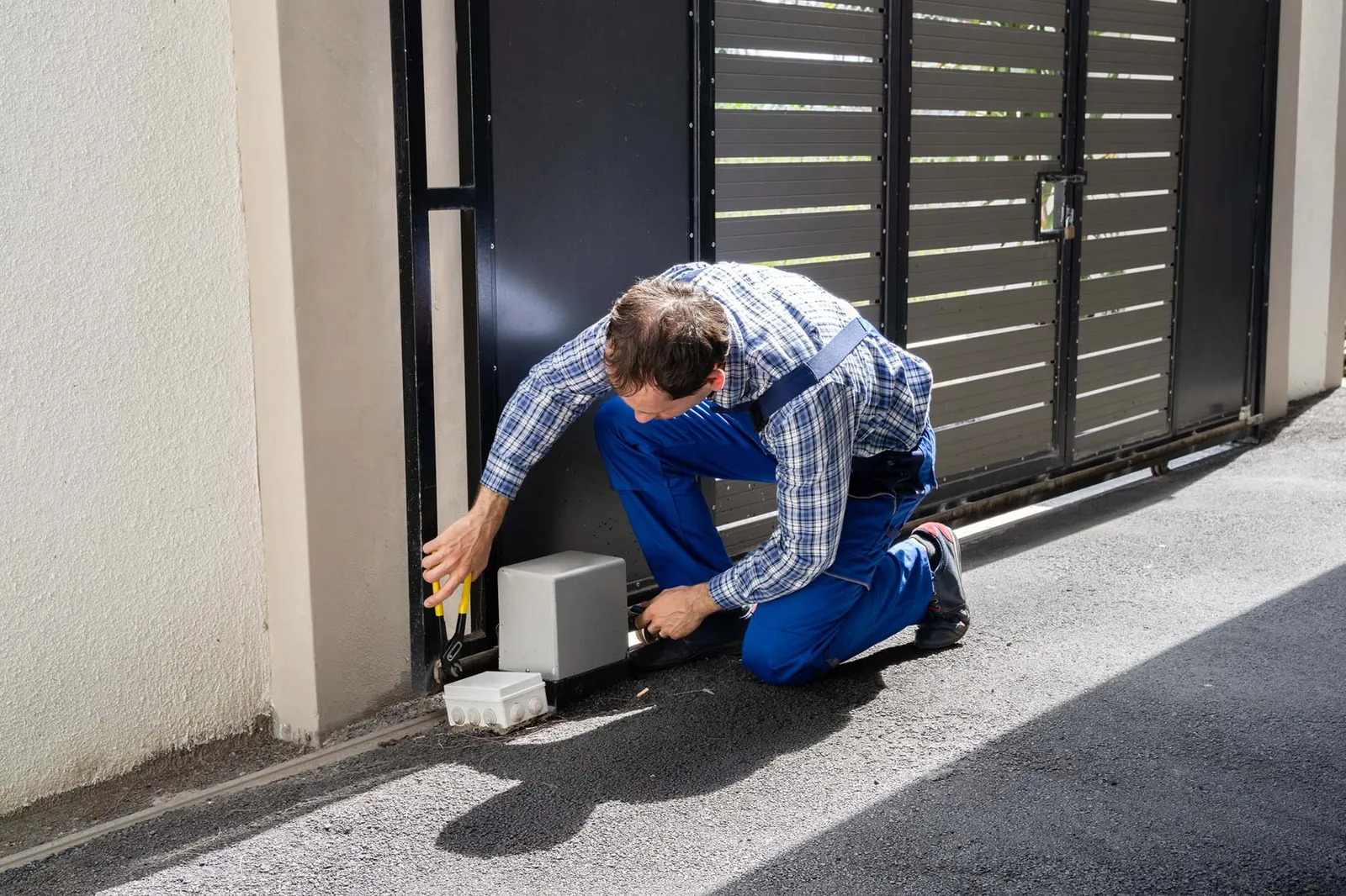 Man fixing an automatic gate